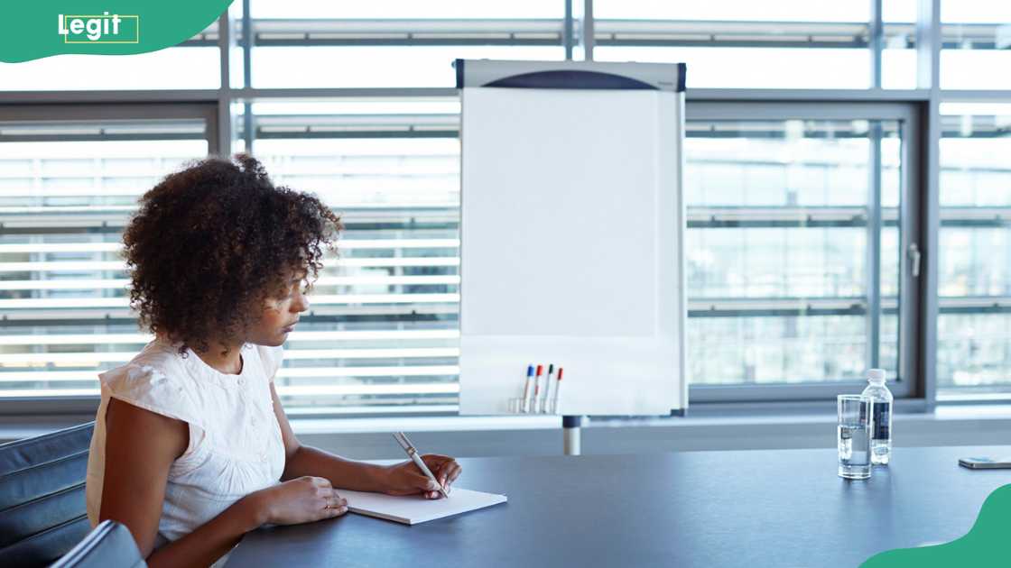 A woman writing a letter A woman writing a letter