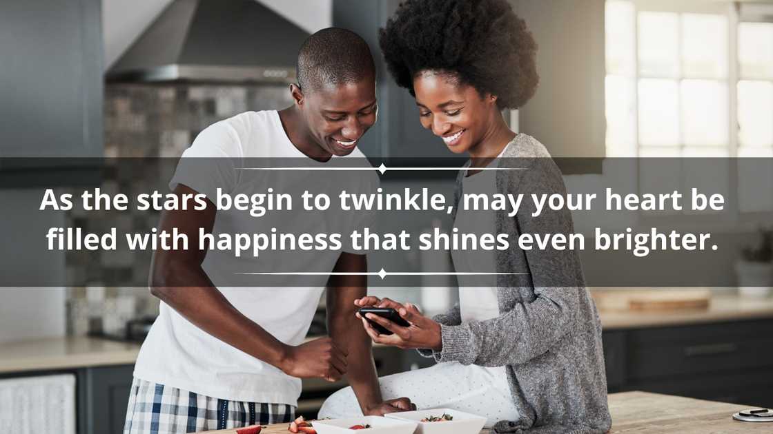 A happy young couple using a mobile phone while preparing a healthy snack at home. A happy young couple using a mobile phone while preparing a healthy snack at home.