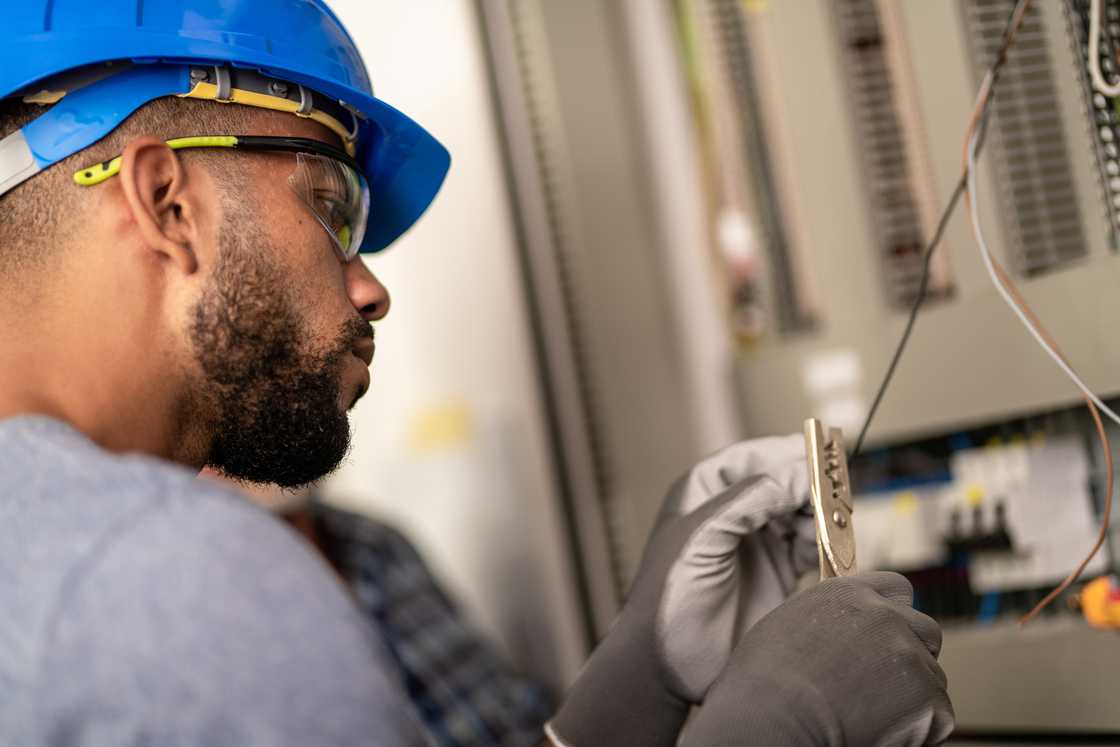 An electrician providing electrical repair services