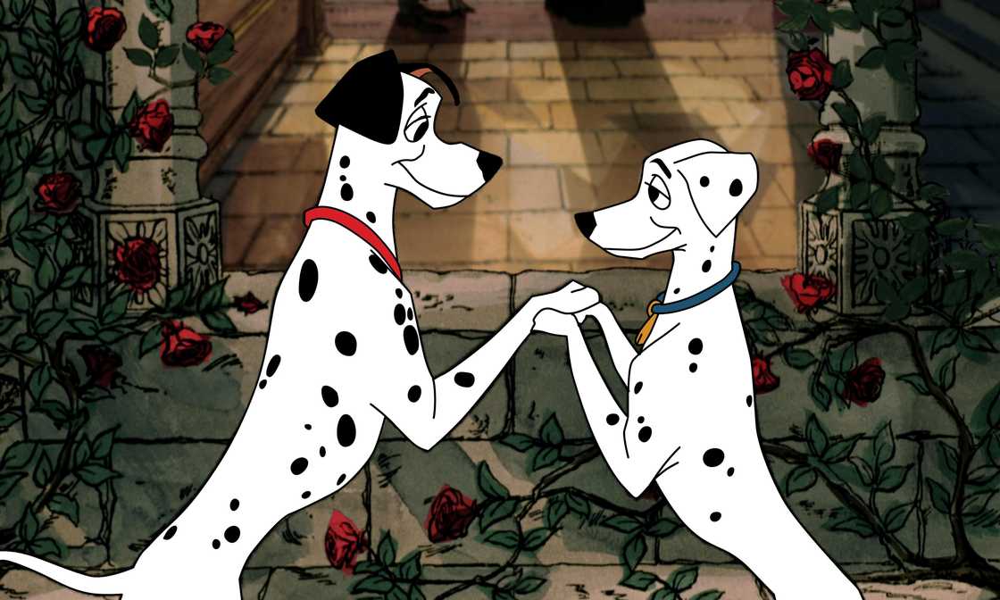 An illustration of Pongo and Perdita holding their front paws together. An illustration of Pongo and Perdita holding their front paws together.