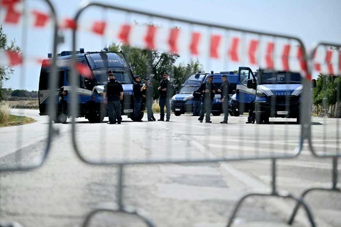 Security at the summit is tight, with the venue far away from protesters and journalists Security at the summit is tight, with the venue far away from protesters and journalists