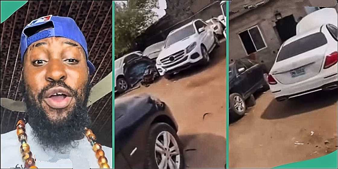 Man displays luxury cars parked at mechanic workshop Man displays luxury cars parked at mechanic workshop