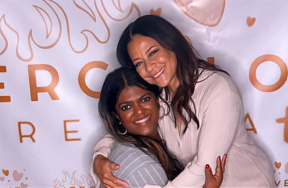 Ruksana Carroll (L) and Sonya Curry (R) embracing each other