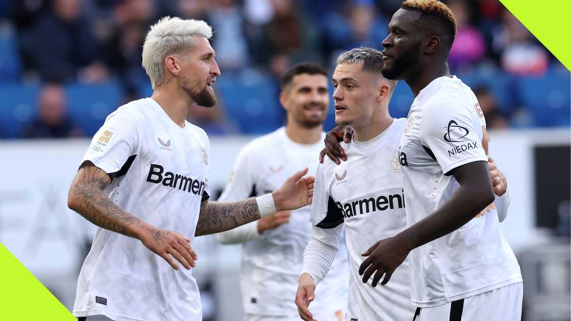 Victor Boniface celebrates with his teammates after scoring for Bayer Leverkusen.