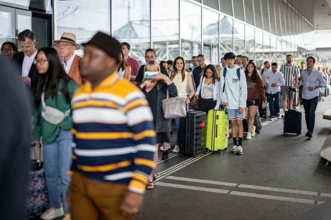 Travellers queued to enter Geneva International Airport before the strike was extended to last through Saturday Travellers queued to enter Geneva International Airport before the strike was extended to last through Saturday