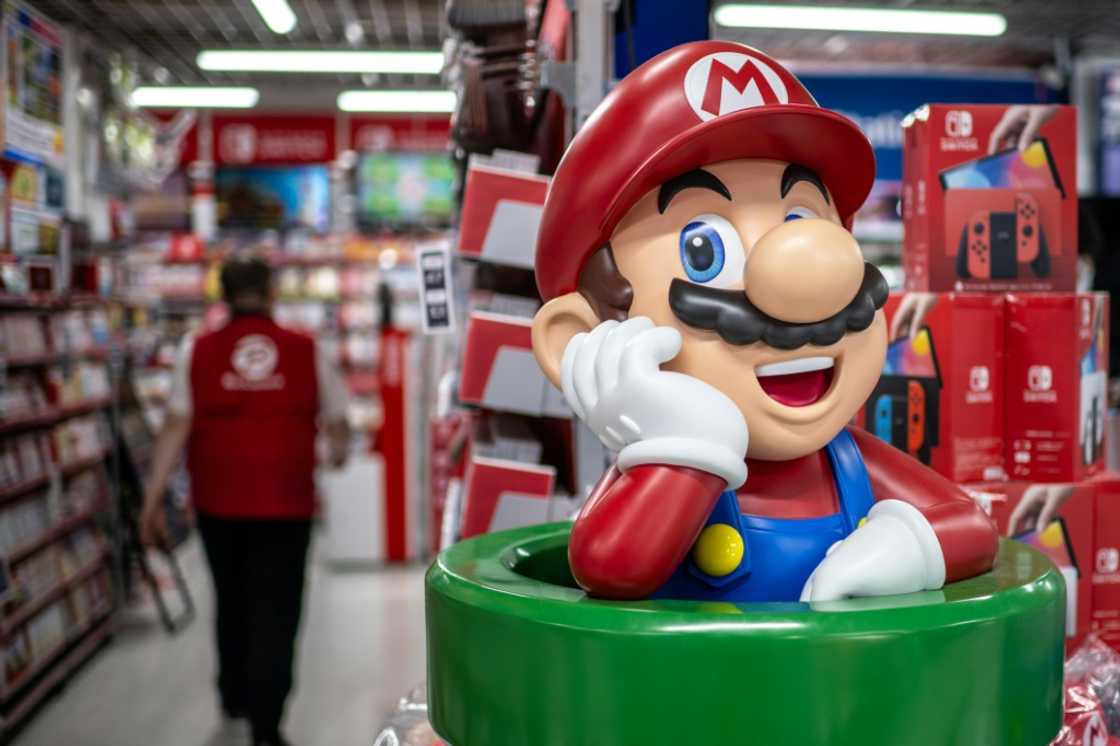 Nintendo cut its net profit forecast after sales for its Switch console fell in the first three quarters