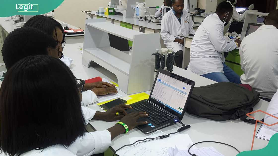 Covenant University students in a science laboratory Covenant University students in a science laboratory