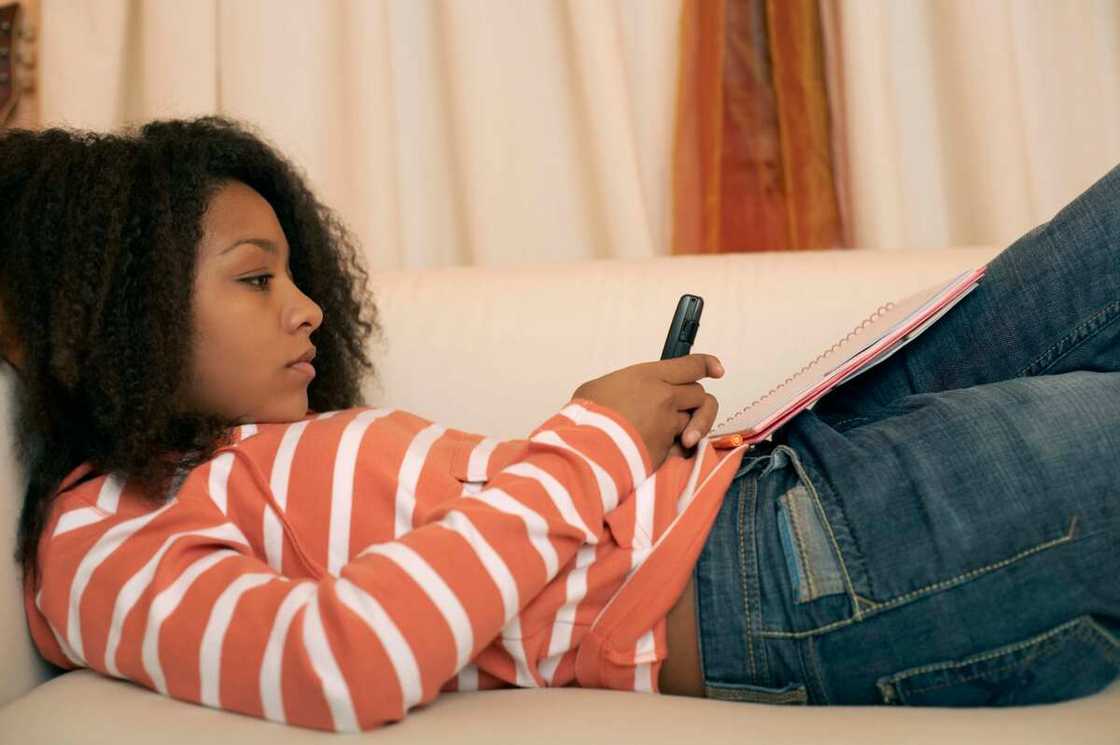 Girl lying texting Girl lying texting