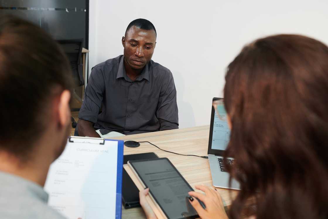 A tense employee in a meeting A tense employee in a meeting