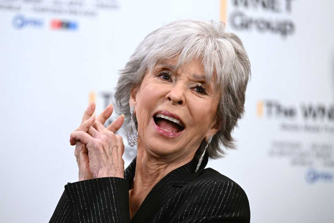 Rita Moreno clutch her hands as she laughs at Edison Ballroom Rita Moreno clutch her hands as she laughs at Edison Ballroom