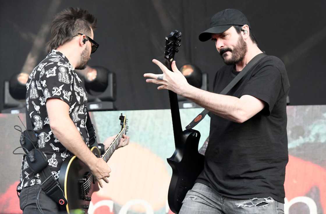 Breaking Benjamin band members, Keith Wallen (L) and Benjamin Burnley, perform at an event in California Breaking Benjamin band members, Keith Wallen (L) and Benjamin Burnley, perform at an event in California