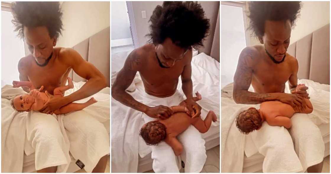 Omashola massages son.