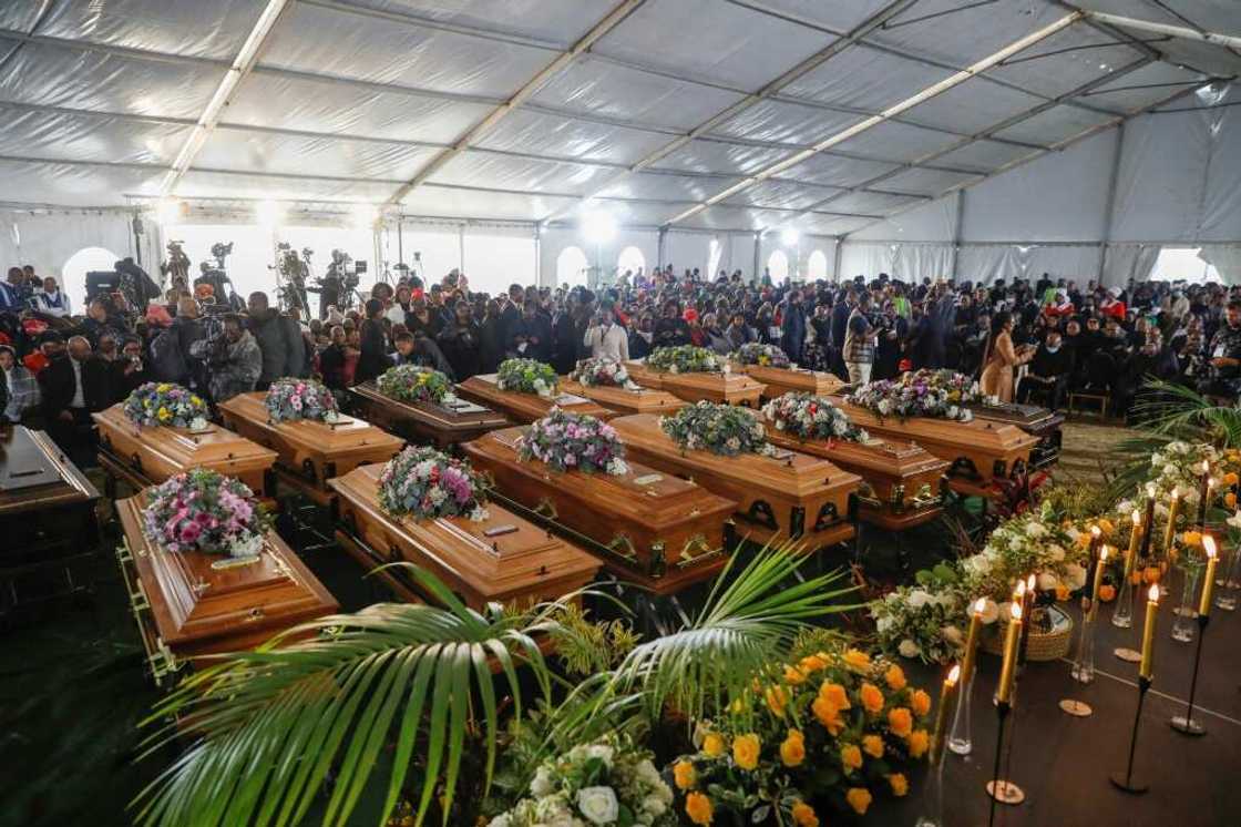 A memorial service for the 21 dead, using empty coffins as symbols of the loss, was held on July 6 A memorial service for the 21 dead, using empty coffins as symbols of the loss, was held on July 6