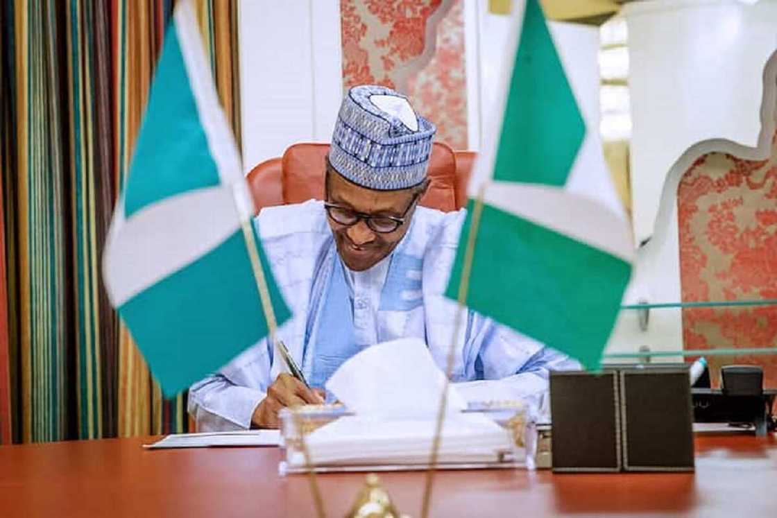 Buhari signs Buhari signs