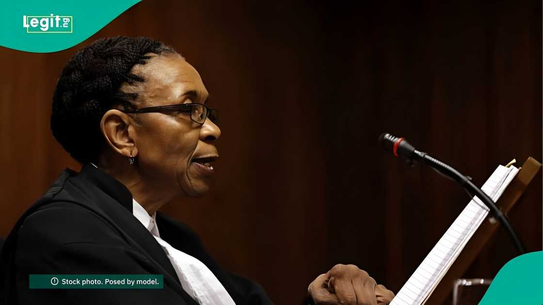 A courtroom scene where a judge is delivering a verdict on an inheritance dispute involving children born out of wedlock.