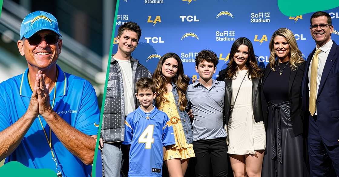 Jim Harbaugh smiles while on a football field. The head coach poses with his family during a press conference. Jim Harbaugh smiles while on a football field. The head coach poses with his family during a press conference.