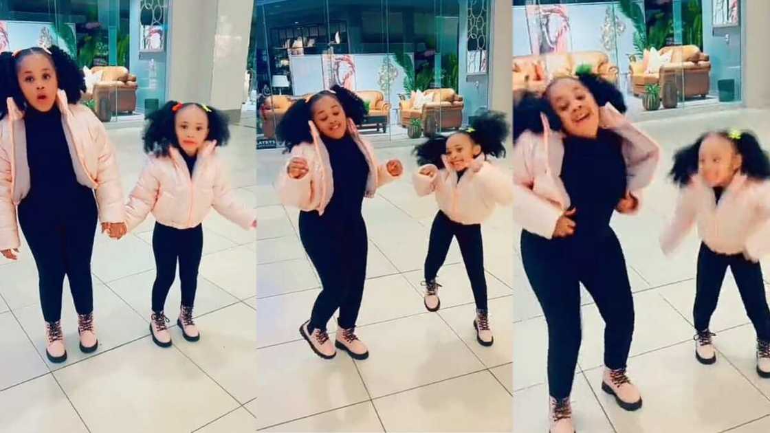 Photo of little girl and her elder sister dancing Photo of little girl and her elder sister dancing