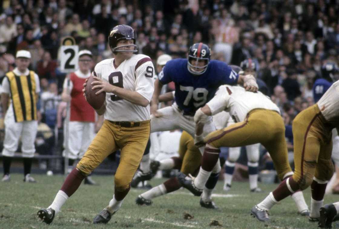 Quarterback Sonny Jurgensen #9 of the Washington Redskins drops back to pass against the New York Giants at Yankee Stadium