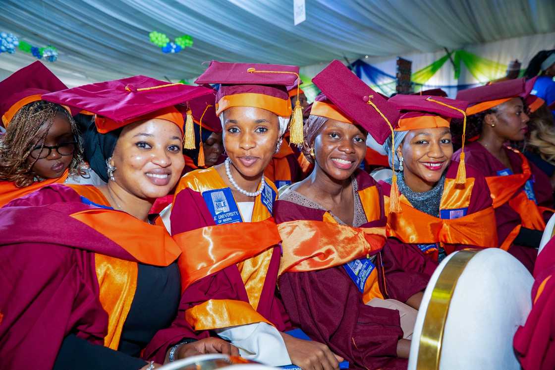 Nile University students posing for a photo on graduation day Nile University students posing for a photo on graduation day