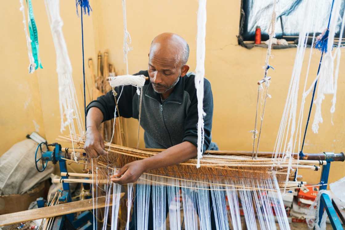'What we produce with so much effort can now be made instantly by machines,' says Getu Derza, who began crafting habesha kemis dresses when he was 14 'What we produce with so much effort can now be made instantly by machines,' says Getu Derza, who began crafting habesha kemis dresses when he was 14