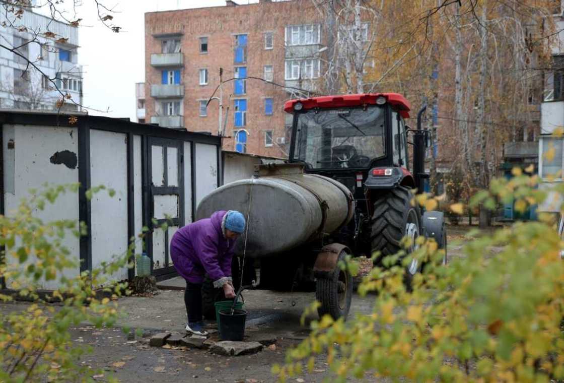 Yevgen Gamiy's tractor is the main source of water for the basement dwellers of Stepnogirsk Yevgen Gamiy's tractor is the main source of water for the basement dwellers of Stepnogirsk