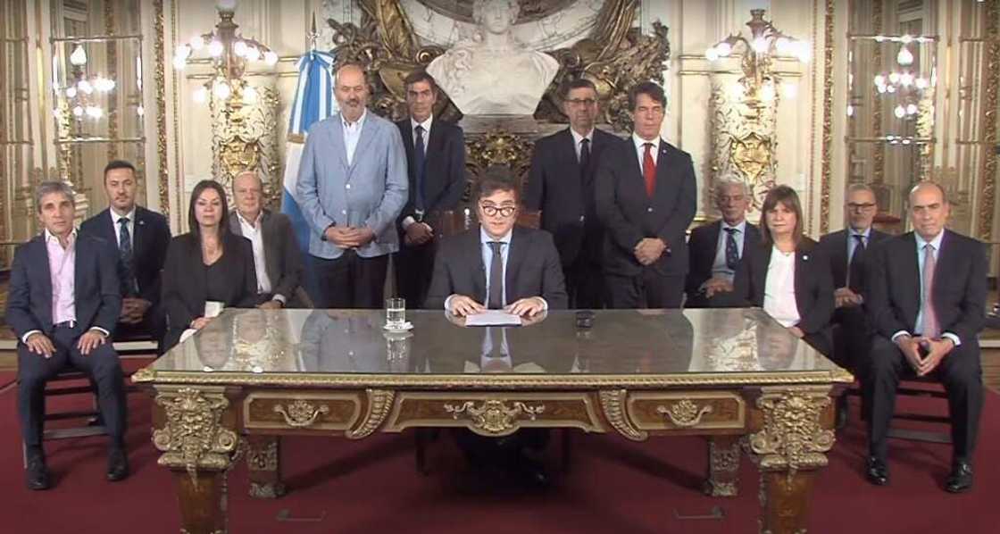Argentine President Javier Milei (C) delivered his speech to the nation from the Casa Rosada presidential palace in Buenos Aires, flanked by his cabinet Argentine President Javier Milei (C) delivered his speech to the nation from the Casa Rosada presidential palace in Buenos Aires, flanked by his cabinet