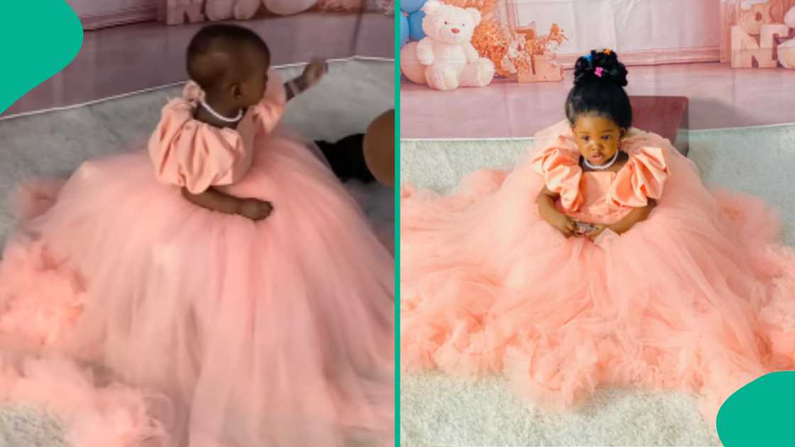 Baby frustrates her mother during birthday photoshoot.