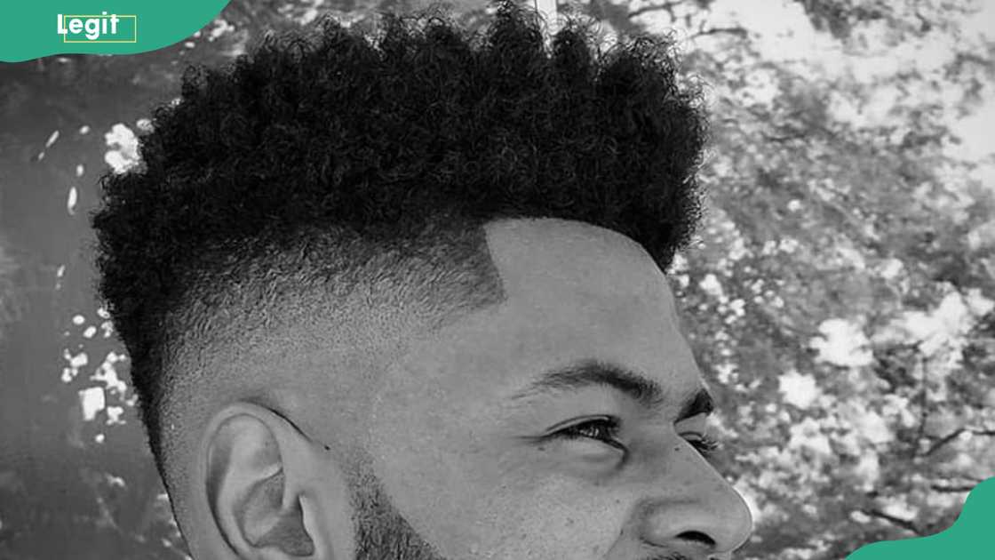 Low curly fauxhawk hairstyle for men Low curly fauxhawk hairstyle for men