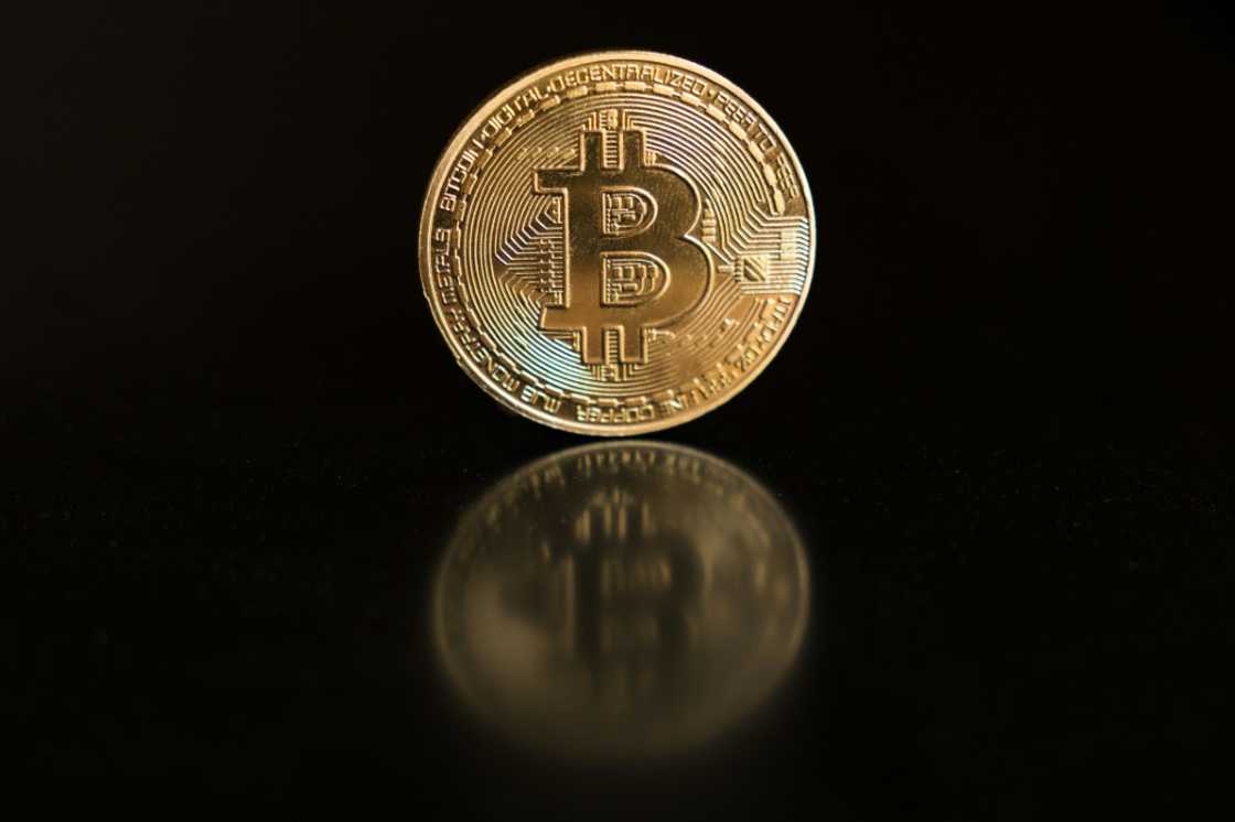 This photo illustration shows a physical representation of a bitcoin This photo illustration shows a physical representation of a bitcoin