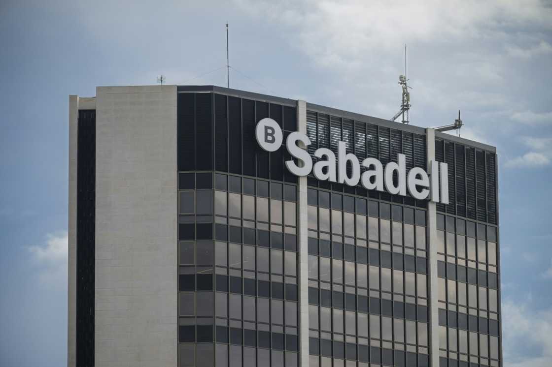 Some observers believe Sabadell's return is motivated more by its attempts to stave off a hostile takeover bid by larger Spanish rival BBVA Some observers believe Sabadell's return is motivated more by its attempts to stave off a hostile takeover bid by larger Spanish rival BBVA