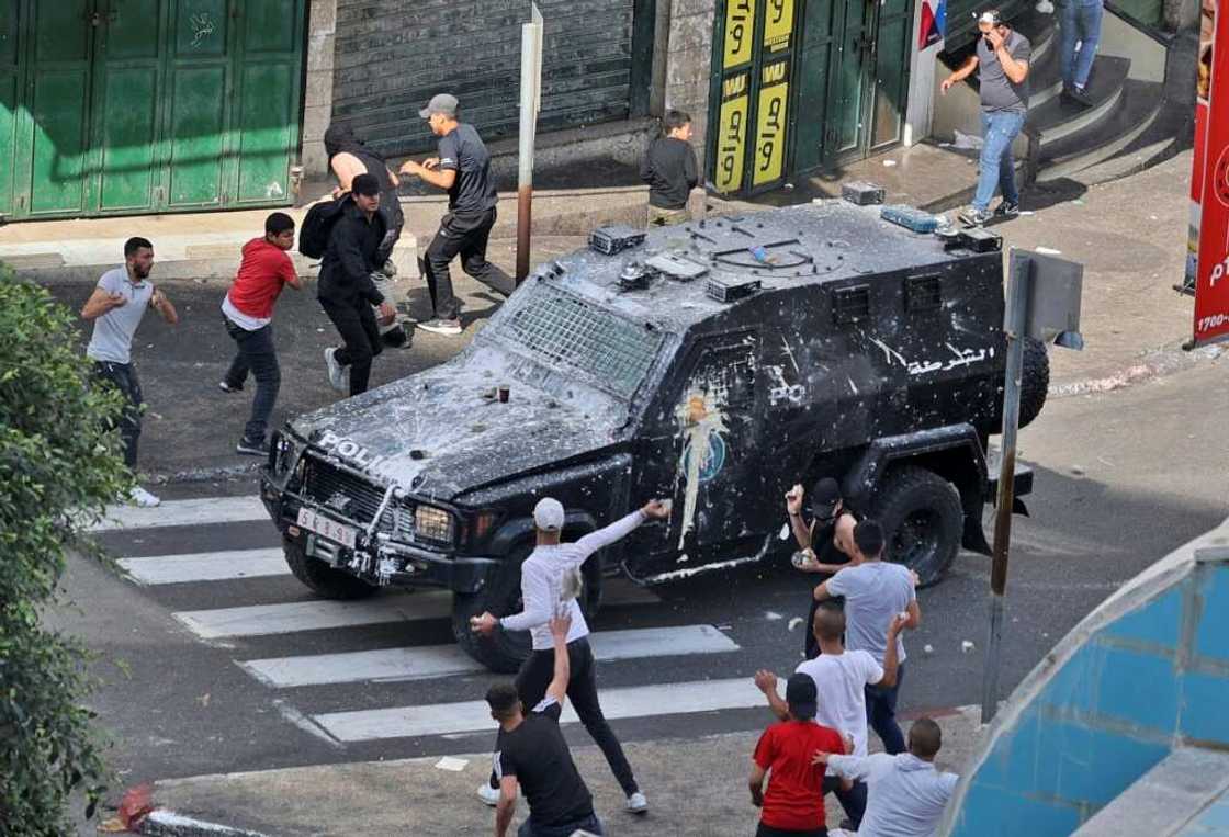 Youths hurl stones at a Palestinian Authority armoured truck amid anger at the security forces' arrest of two Hamas members in an operation seen as carried out at Israel's behest Youths hurl stones at a Palestinian Authority armoured truck amid anger at the security forces' arrest of two Hamas members in an operation seen as carried out at Israel's behest
