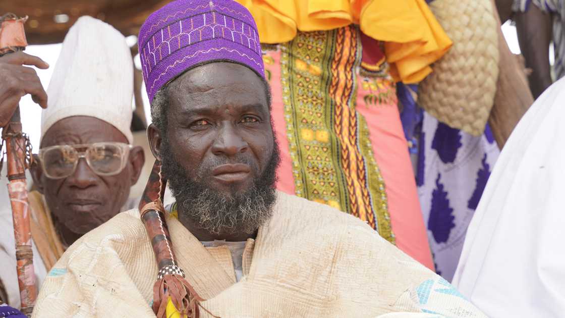 A serious elder listening attentively A serious elder listening attentively