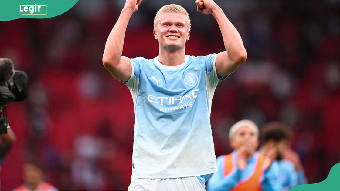 Erling Haaland, in Manchester City's sky-blue kit, raises both fists to celebrate the 1-0 win over Manchester United at Old Trafford on 13 September 2026. Erling Haaland, in Manchester City's sky-blue kit, raises both fists to celebrate the 1-0 win over Manchester United at Old Trafford on 13 September 2026.