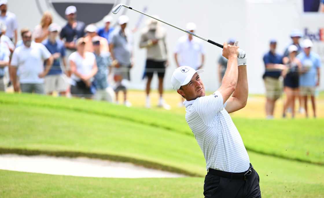 Jordan Spieth hits his second shot at the 18th hole during the final round of FedEx St. Jude Championship Jordan Spieth hits his second shot at the 18th hole during the final round of FedEx St. Jude Championship