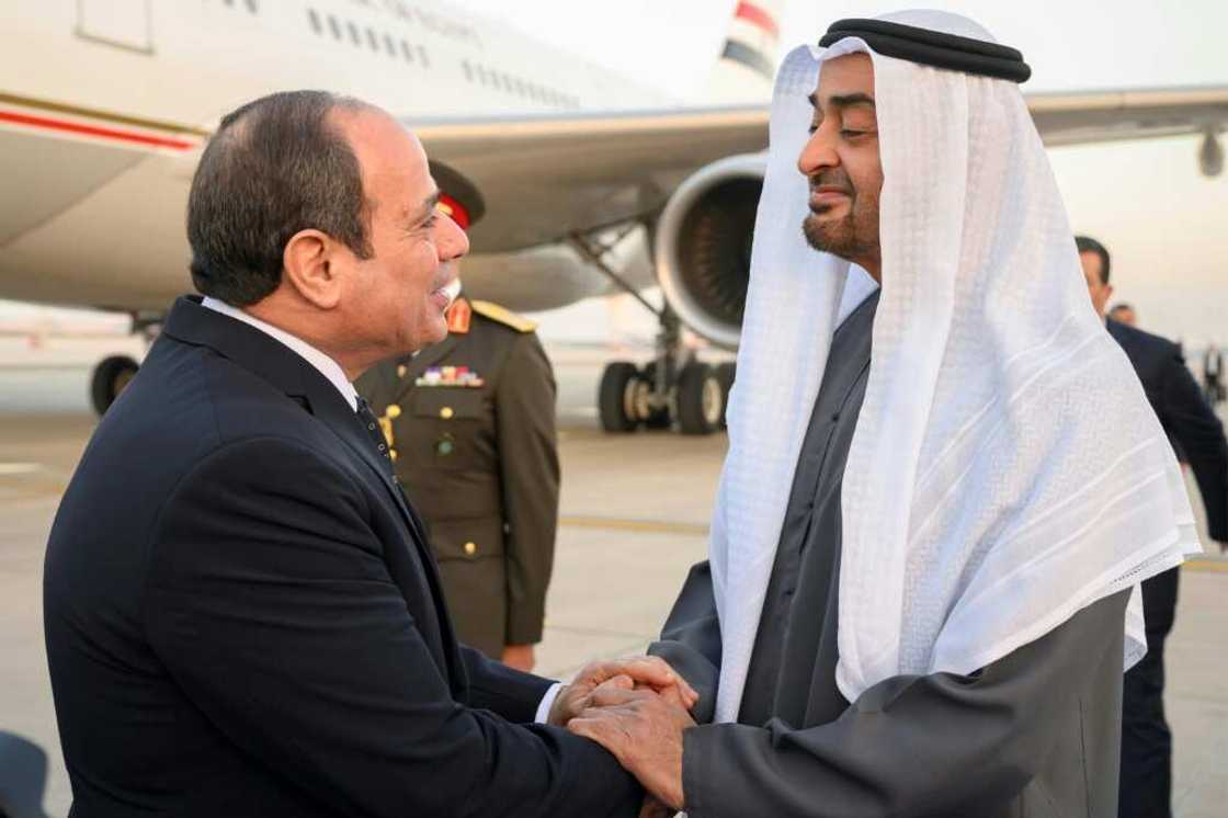 A handout picture released by the United Arab Emirates' presidential court shows Emirati President Sheikh Mohamed bin Zayed Al-Nahyan (R) welcoming Egypt's President Abdel Fattah al-Sisi in Abu Dhabi on February 12, 2023 A handout picture released by the United Arab Emirates' presidential court shows Emirati President Sheikh Mohamed bin Zayed Al-Nahyan (R) welcoming Egypt's President Abdel Fattah al-Sisi in Abu Dhabi on February 12, 2023