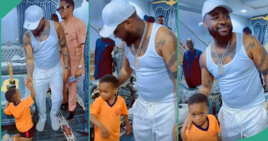 Boy kneels to greet Davido. Boy kneels to greet Davido.