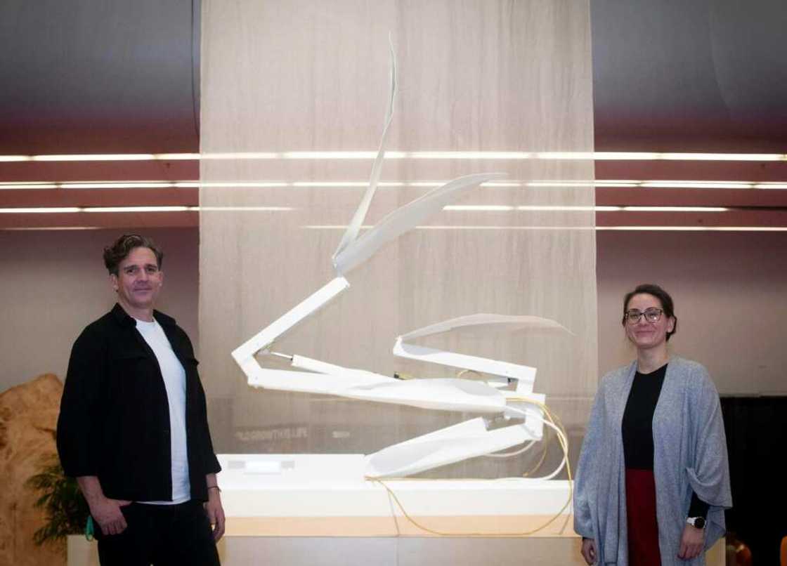 Dutch artist Thijs Biersteker (L) and scientist Adriana de Palma pose in front of "ECONARIO" an art installation by Biersteker, during the United the Nations Biodiversity Conference (COP15) in Montreal Dutch artist Thijs Biersteker (L) and scientist Adriana de Palma pose in front of "ECONARIO" an art installation by Biersteker, during the United the Nations Biodiversity Conference (COP15) in Montreal