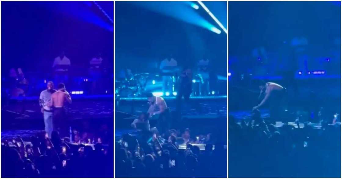 Wizkid reacts as fan runs on stage to hug him at MSG show. Wizkid reacts as fan runs on stage to hug him at MSG show.