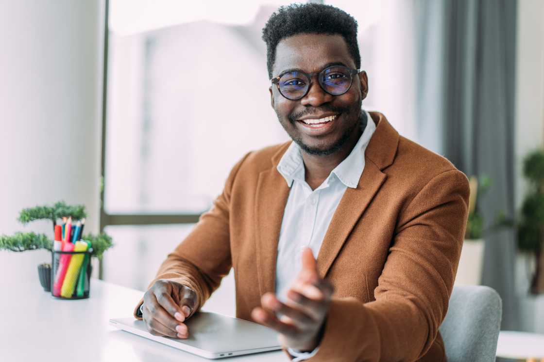 A businessman sitting on his desk in the office.