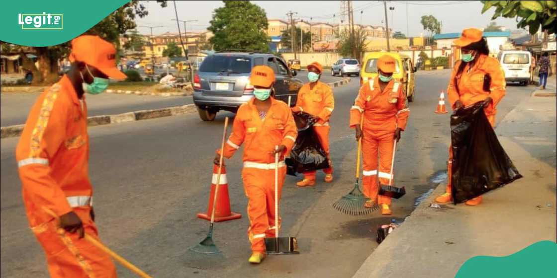 LAWMA street sweepers at work along a major road in Lagos.