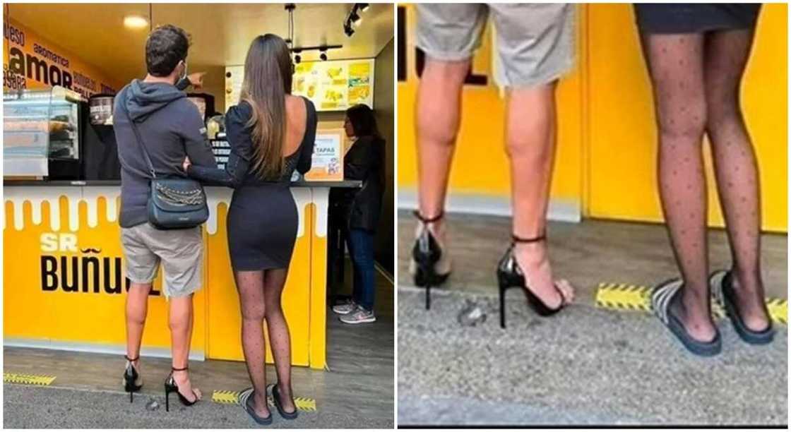 Photo of man wearing high heels while his woman wears slippers. Photo of man wearing high heels while his woman wears slippers.