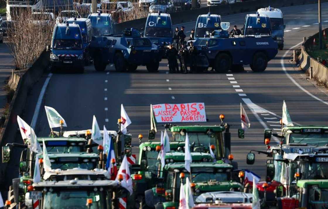 Police and armoured vehicles have been deployed to watch over farmers' blockades Police and armoured vehicles have been deployed to watch over farmers' blockades