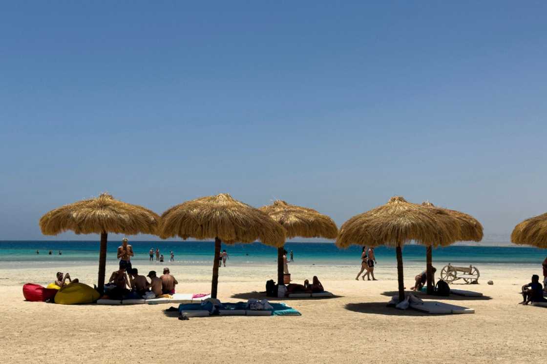 Tourists gather at the beach at Ras Hankorab on the Red Sea in southern Egypt Tourists gather at the beach at Ras Hankorab on the Red Sea in southern Egypt