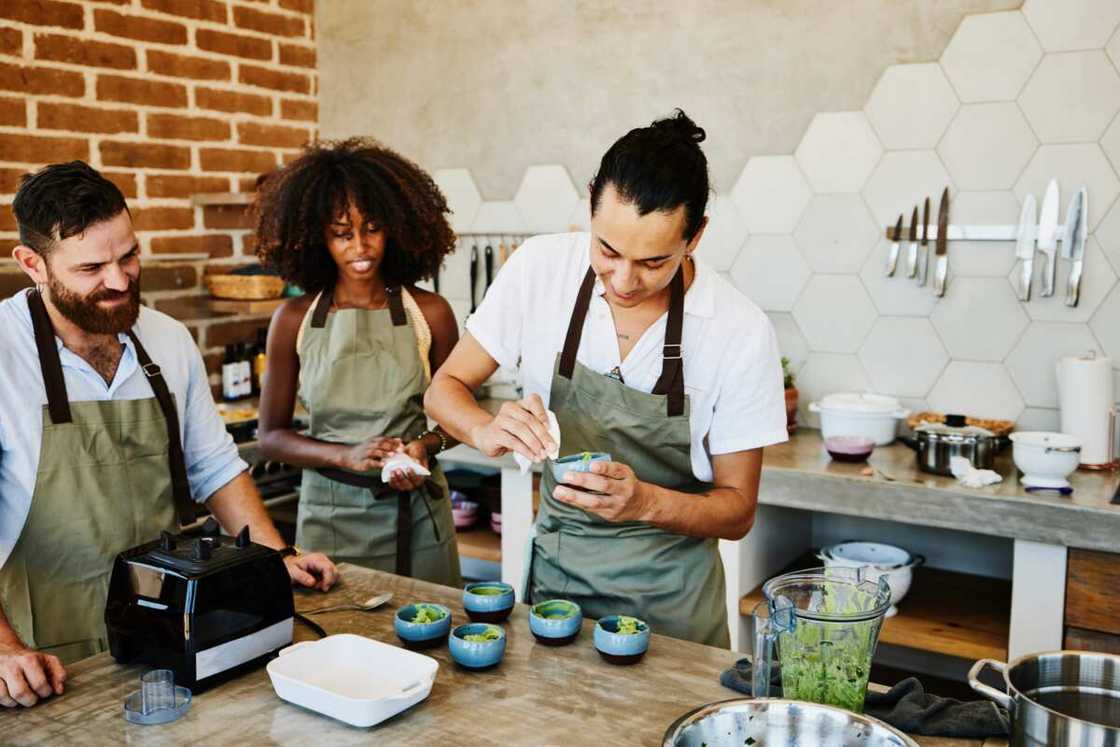 Friends during a vegetarian cooking class in the demonstration kitchen