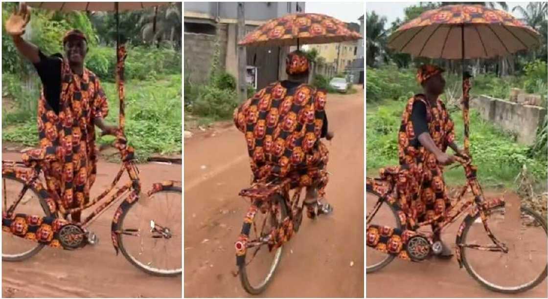 Nigerian man dresses himself, his bicycle and umbrella in Isiagu dress. Nigerian man dresses himself, his bicycle and umbrella in Isiagu dress.