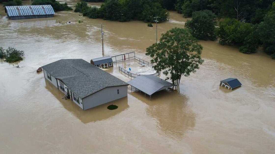 Homes submerged under flood waters from the North Fork of the Kentucky River are seen from a drone in Jackson, Kentucky