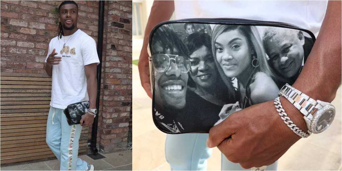 Super Eagles star shows off customized purse with a picture of his lovely family Super Eagles star shows off customized purse with a picture of his lovely family