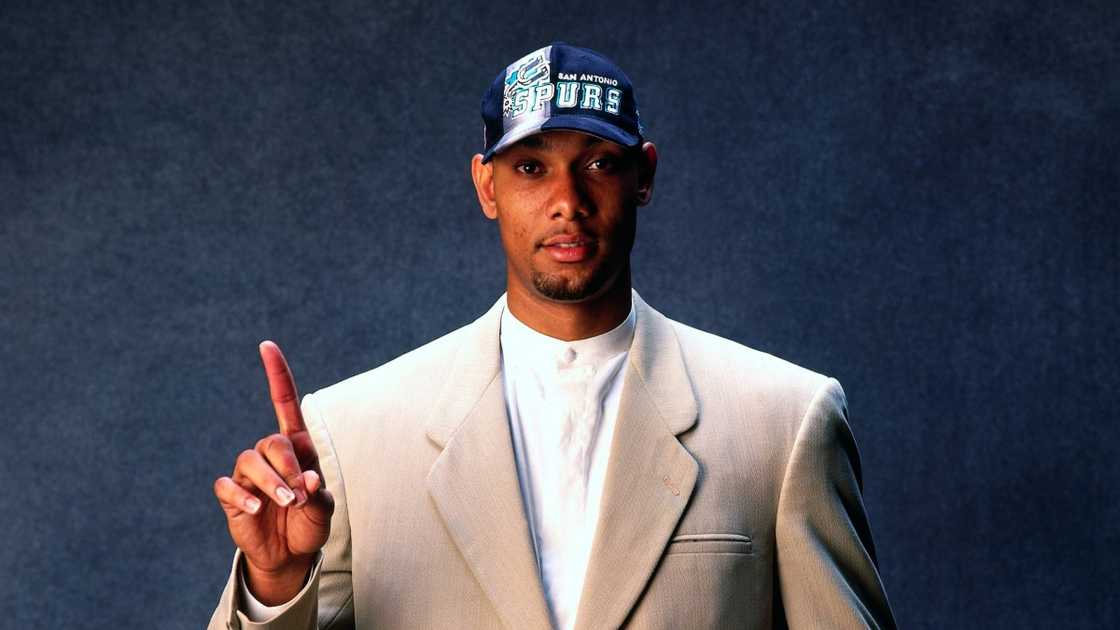 Tim Duncan poses during the 1997 NBA Draft. Tim Duncan poses during the 1997 NBA Draft.