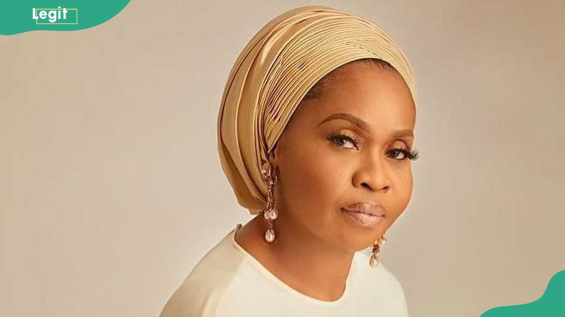 Hajia Bola Shagaya in front a cream background