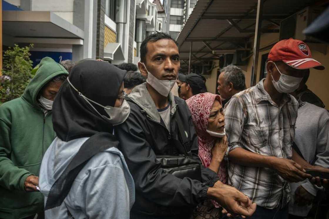 Relatives waited anxiously at hospitals around Malang for news about their loved ones